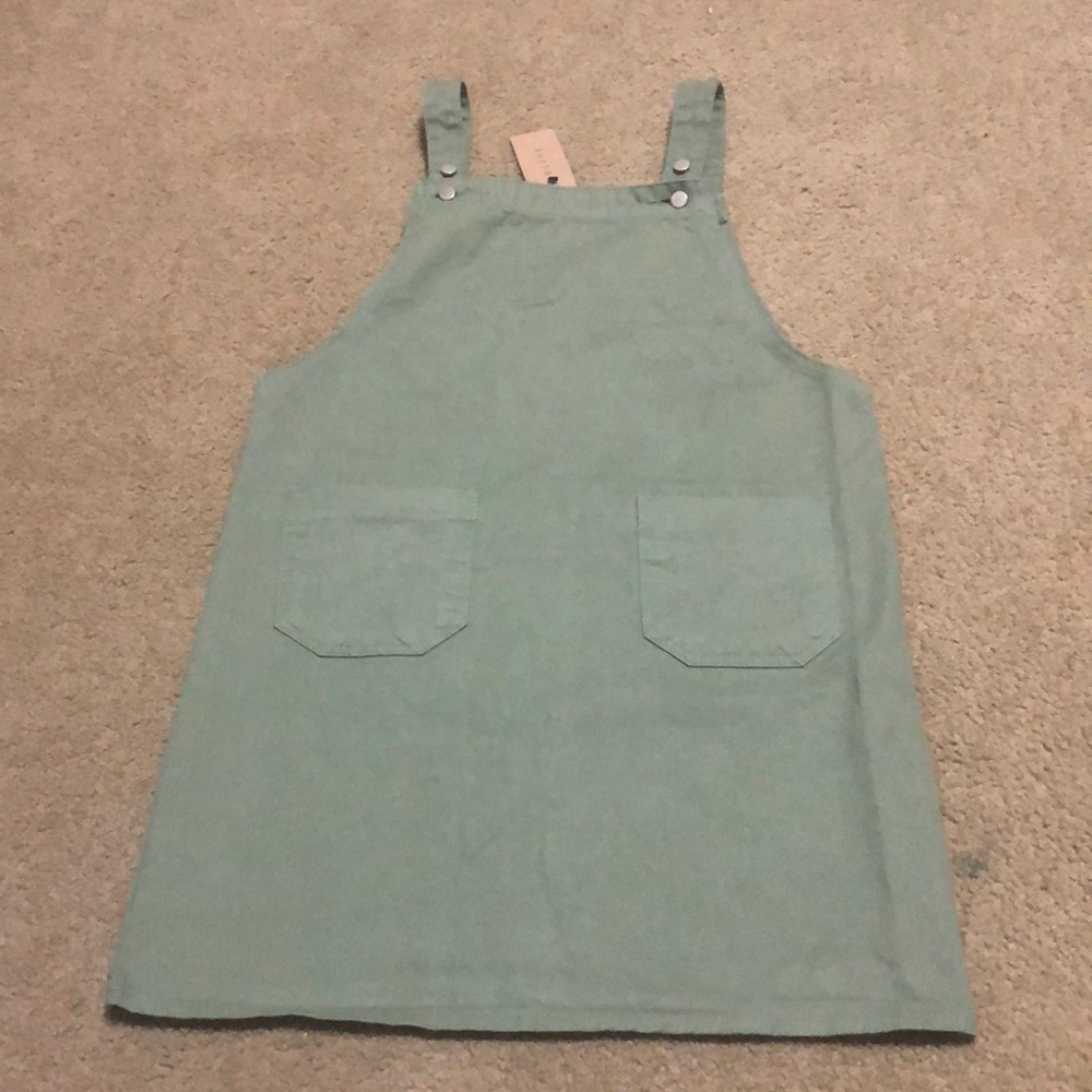 Green apron overall dress.
